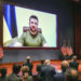 FILE - Members of Congress give Ukraine President Volodymyr Zelensky a standing ovation before he speaks in a virtual address to Congress in the U.S. Capitol Visitors Center Congressional Auditorium in Washington, on Wednesday, March 16, 2022. Ukraine, which has waged a staunch defense against Russian invasion, says it has pioneered a new source of financial support: People around the world who have donated millions of dollars directly to its war effort via cryptocurrencies such as bitcoin.  (Sarahbeth Maney/The New York Times via AP, Pool, File)