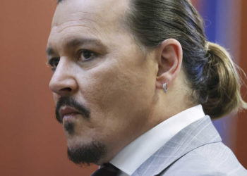 Actor Johnny Depp arrives in the courtroom in the Fairfax County Circuit Courthouse in Fairfax, Va., Thursday, May 26, 2022. Actor Johnny Depp sued his ex-wife Amber Heard for libel in Fairfax County Circuit Court after she wrote an op-ed piece in The Washington Post in 2018 referring to herself as a "public figure representing domestic abuse." (Michael Reynolds/Pool Photo via AP)