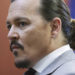 Actor Johnny Depp arrives in the courtroom in the Fairfax County Circuit Courthouse in Fairfax, Va., Thursday, May 26, 2022. Actor Johnny Depp sued his ex-wife Amber Heard for libel in Fairfax County Circuit Court after she wrote an op-ed piece in The Washington Post in 2018 referring to herself as a "public figure representing domestic abuse." (Michael Reynolds/Pool Photo via AP)