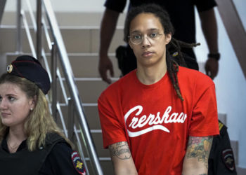 WNBA star and two-time Olympic gold medalist Brittney Griner is escorted to a courtroom for a hearing, in Khimki just outside Moscow, Russia, Thursday, July 7, 2022. Griner pleaded guilty Thursday to drug possession charges on the second day of her trial in a Russian court in a case that could see her sentenced to up to 10 years in prison. (AP Photo/Alexander Zemlianichenko)