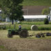 KALONA, USA - JUNE 02: A young Amish farmer dismounts his steel-wheeled tractor in Kalona, Iowa, on June 02, 2017. Amish farmers say they use steel wheels on their tractor so that they aren't tempted to drive it on paved roads. (Photo by Rachel Mummey for The Washington Post via Getty Images)