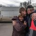 epaselect epa09905154 Oleksandr (25, C), meets his parents Olga (49) and Oleksandr (50) who fled from the currently Russian-occupied village Lyubimivka, at the evacuation point in Zaporizhzhia, Ukraine, 23 April 2022. Thousands of people who still remained trapped in Mariupol and others occupied by the Russian army areas in South Ukraine wait to be evacuated to Ukraine's controlled area by buses and their own cars.  EPA/ROMAN PILIPEY