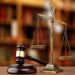 Gavel And Scales Of Justice On Desk In Law Office