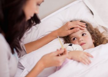 Mother taking care of her sick daughter