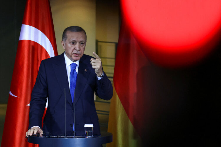 FILE PHOTO: Turkish President Tayyip Erdogan gestures as he attends a press conference with German Chancellor Olaf Scholz (not pictured) at the Chancellery in Berlin, Germany, November 17, 2023. REUTERS/Liesa Johannssen/File Photo