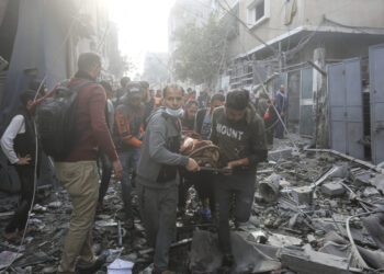 Palestinians evacuate wounded in Israeli bombardment Rafah, Gaza Strip, Friday, Dec. 1, 2023. (AP Photo/Hatem Ali)