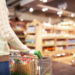 Woman with a cart in a store