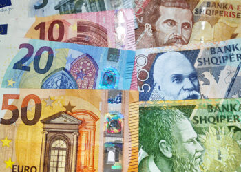 Close-up on a stack of Euros and Albanian Lek.