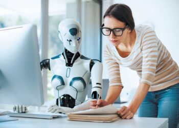 Woman and AI robot working together in the office, automation and technology concept