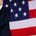 FILE PHOTO: U.S. President Donald Trump stands in front of a U.S. flag while listening to U.S. first lady Melania Trump give a speech to U.S. troops at the Naval Air Station Sigonella before returning to Washington D.C. at Sigonella Air Force Base in Sigonella, Sicily, Italy, May 27, 2017. REUTERS/Jonathan Ernst/File Photo