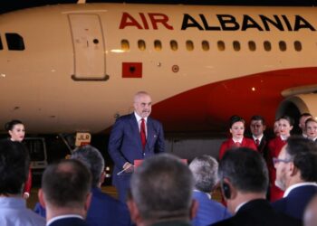 TIRANA, ALBANIA - SEPTEMBER 14: Albanian Prime Minister Edi Rama (C) makes a speech during the opening ceremony of the newly established Air Albania at the Tirana International Airport Nene Tereza, in Tirana, Albania on September 14, 2018. Turkey's national flag carrier Turkish Airlines established a joint venture company in Albania. Turkish Ambassador to Tirana Murat Ahmet Yoruk, Albanian government's representatives and Turkish Airlines officials also attended the opening ceremony. (Photo by Olsi Shehu/Anadolu Agency/Getty Images)