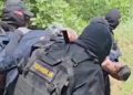 Serbian security forces detain Kosovo police officers in a location given as near Gnjilica, Serbia June 14, 2023 in this screengrab obtained from a handout video. MINISTRY OF INTERNAL AFFAIRS OF SERBIA/via REUTERS  THIS IMAGE HAS BEEN SUPPLIED BY A THIRD PARTY. MANDATORY CREDIT. NO RESALES. NO ARCHIVES. REUTERS WAS NOT ABLE TO INDEPENDENTLY VERIFY THE LOCATION OF THE VIDEO