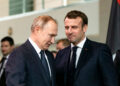 BERLIN, GERMANY - JANUARY 19: French President Emmanuel Macron (R) and Russian President Vladimir Putin (L) arrive for a family picture at the Chancellery on January 19, 2020 in Berlin, Germany. Leaders of nations and organizations linked to the current conflict are meeting to discuss measures towards reaching a consensus between the warring sides and ending hostilities. (Photo by Emmanuele Contini/Getty Images)
