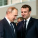 BERLIN, GERMANY - JANUARY 19: French President Emmanuel Macron (R) and Russian President Vladimir Putin (L) arrive for a family picture at the Chancellery on January 19, 2020 in Berlin, Germany. Leaders of nations and organizations linked to the current conflict are meeting to discuss measures towards reaching a consensus between the warring sides and ending hostilities. (Photo by Emmanuele Contini/Getty Images)