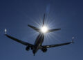 A Southwest plane flies low over Gravelly Point on approach to Ronald Reagan Washington National Airport in Arlington, Va., Friday, Dec. 30, 2022. The airline returned to a relatively normal flight schedule Friday, as the focus shifts to making things right with what could be well more than a million passengers who missed family connections or flights home during the holidays, and many of whom are still missing luggage. (AP Photo/Carolyn Kaster)