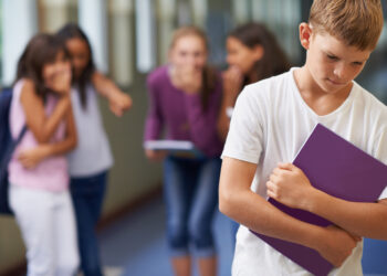 A young boy being bullied at school