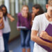 A young boy being bullied at school