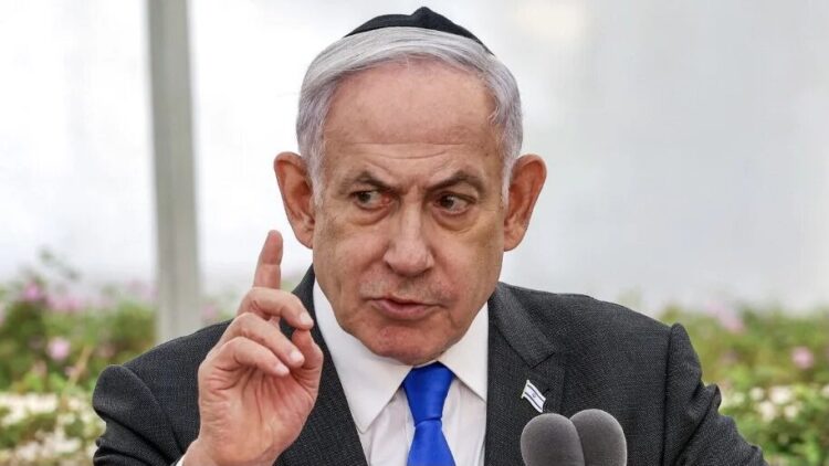 Israeli Prime Minister Benjamin Netanyahu speaks during a state memorial ceremony for the victims of the 1948 Altalena affair, at Nachalat Yitzhak cemetery in Tel Aviv on June 18, 2024. (Photo by Shaul GOLAN / POOL / AFP)