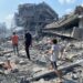 Palestinians inspect the damage following an Israeli airstrike on the El-Remal aera in Gaza City on October 9, 2023. Israel continued to battle Hamas fighters on October 10 and massed tens of thousands of troops and heavy armour around the Gaza Strip after vowing a massive blow over the Palestinian militants' surprise attack. Photo by Naaman Omar apaimages